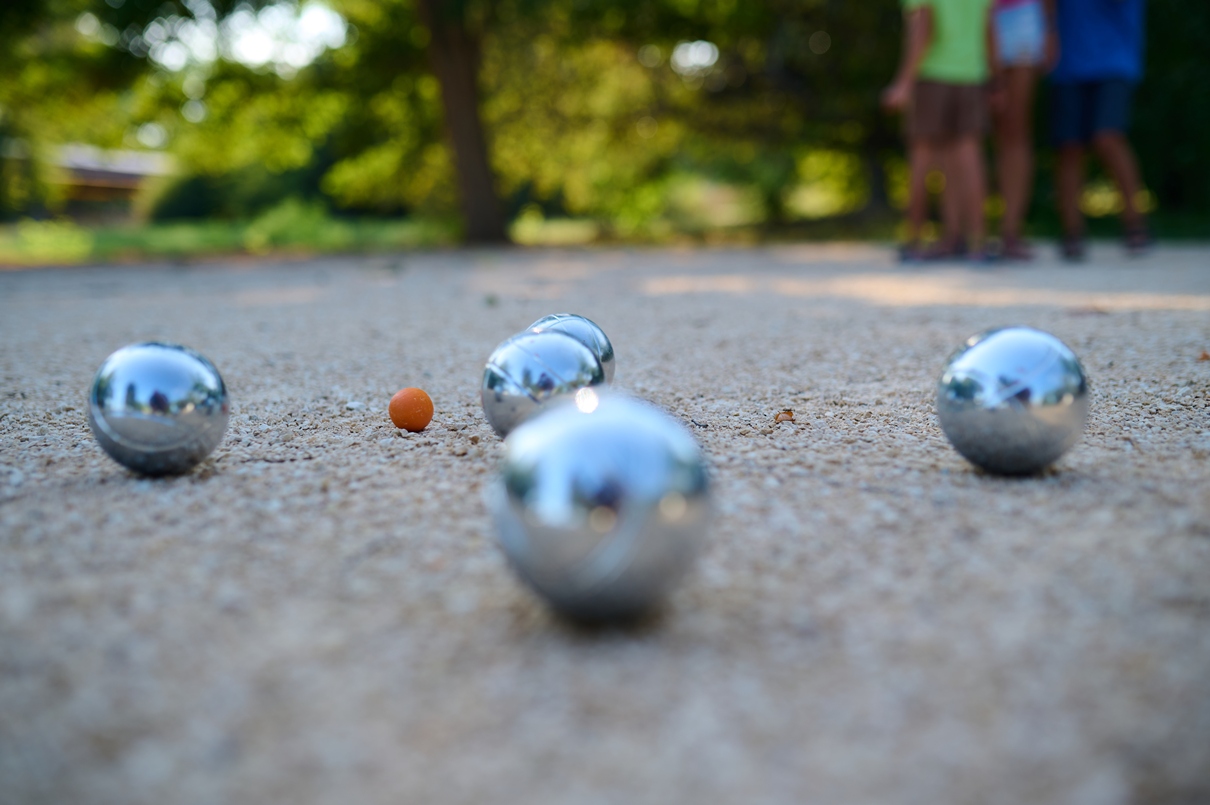 petanque-balls-lie-gravel-with-small-target-ball-focus-while-family